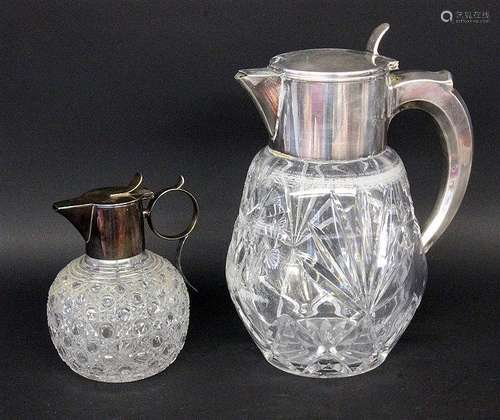 TWO CARAFES Cut glass with metal fitting. 18.5/30