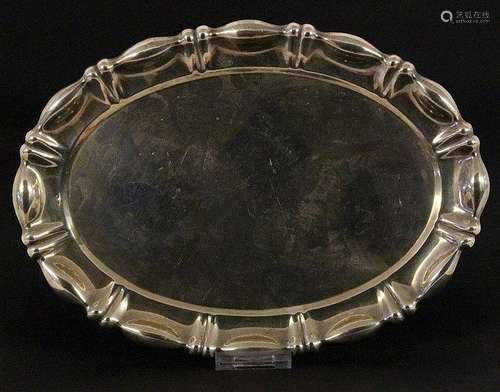 AN OVAL SILVER TRAY with hammered edge. Unknown