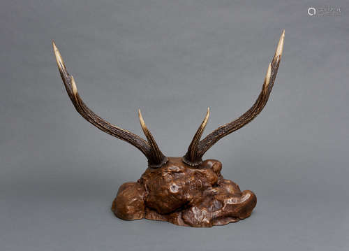 A sword stand formed by an antler of a stag