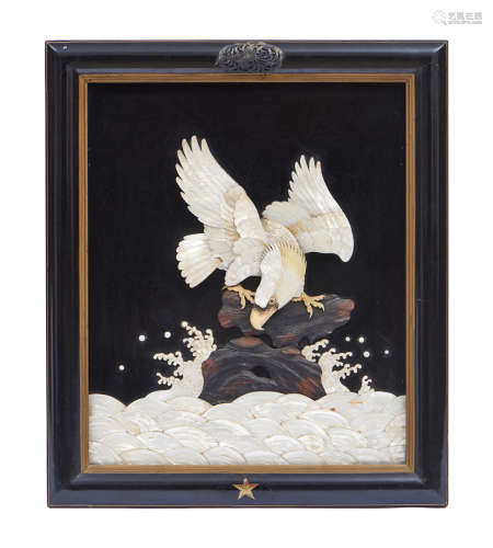 An exceptional framed relief of an eagle perched on a rock