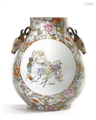 A Chinese gilt-ground famille rose millefleurs deer-head handled pear shaped vase, hu