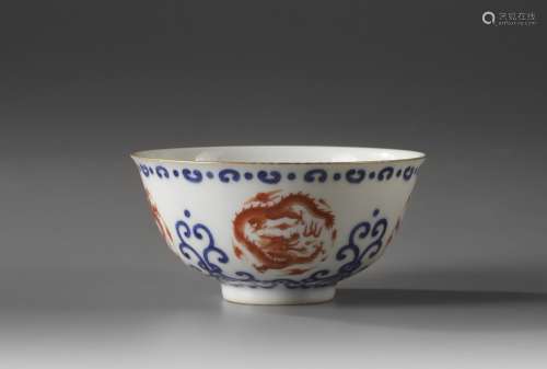 A Chinese iron-red-decorated blue and white 'dragon' bowl