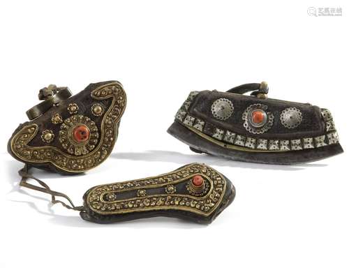 A Mongolian leather flint pocket, a gilt-metal-decorated leather wallet and needle-case