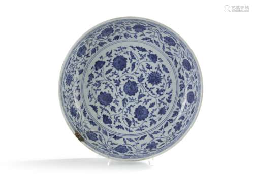 A Chinese Ming-style blue and white 'flower scroll' charger