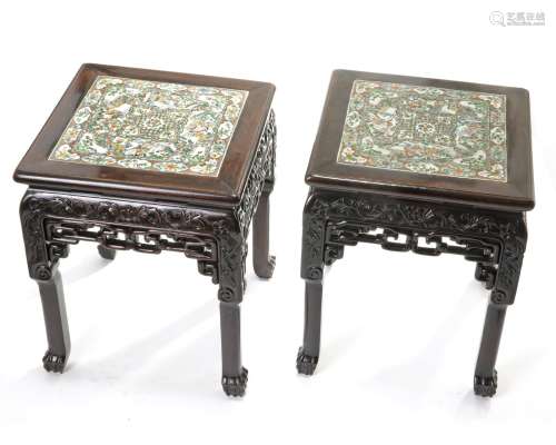 A pair of Chinese hongmu stools inset with a Cantonese famille rose panel