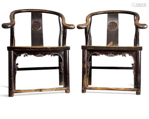 A pair of Chinese horseshoe-back armchairs
