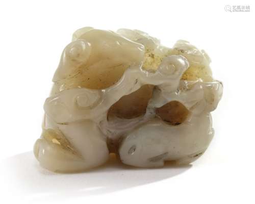 A Chinese celadon jade 'dogs' group