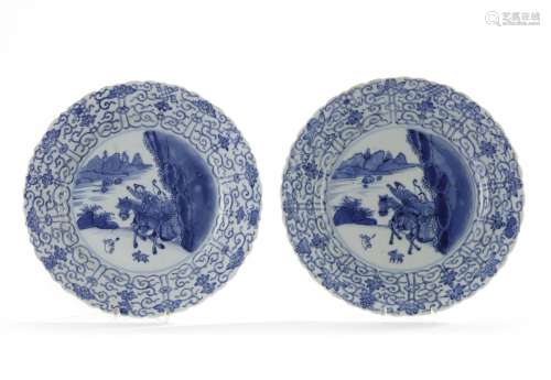 A matched pair of Chinese blue and white 'hunting' dishes