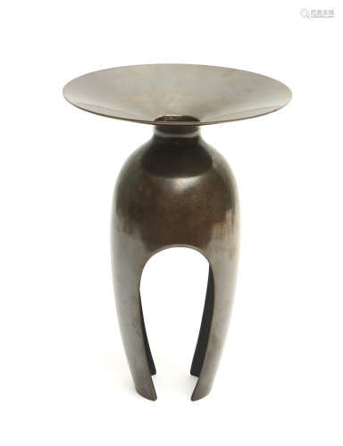 A shining bronze cast ikebana vase