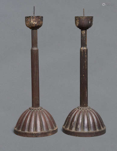 A set of two wooden candlestick-holders with a large chrysanthemum-shaped foot
