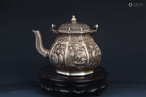 A FINELY CARVED SILVER PLATED BRONZE WATER POT
