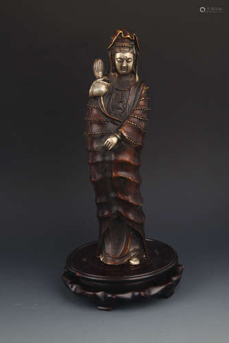 A TALL BRONZE GUAN YIN FIGURE