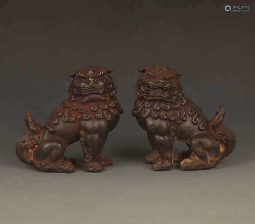 PAIR OF FINELY CARVED CAST IRON LION