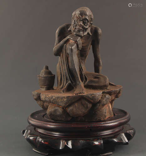 A CAST IRON BODHIDHARMA STATUE