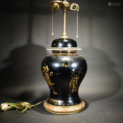 A Black Glazed Gilt Lamp Stand