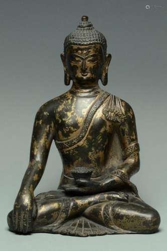 A MING DYNASTY GILT-LACQUERED BRONZE BUDDHA