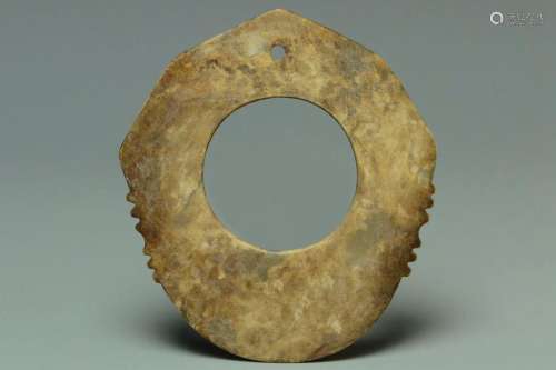 A NEOLITHIC PERIOD JADE RITUAL NOTCHED DISC
