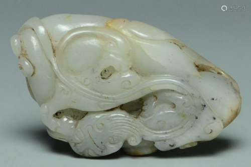A QING DYNASTY WHITE AND RUSSET JADE CARVING