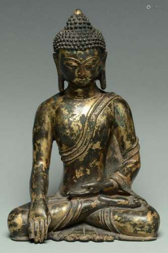 A MING DYNASTY GILT-LACQUERED BRONZE BUDDHA