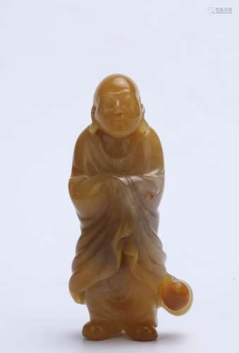 A Chinese Carved Yellow Jade Buddha