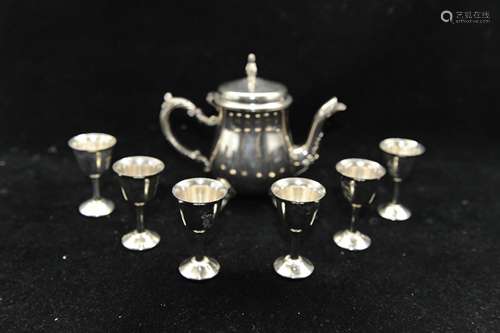 A Set of Seven Cups and Tea Pot