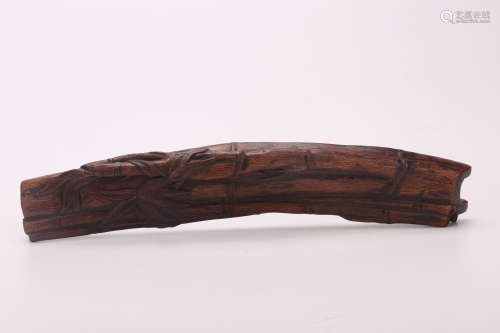 A Chinese Carved Chenxiang Wood Arm Rest