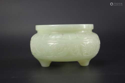 Chinese white jade tripod censer from Qing dynasty. The flattened baluster body is carved to one side with a standing goat and to the other side with a recumbent kid resting on a pine tree branch. The cover is surmounted by another recumbent goat with a pine tree. The stone is of pale-grey tone with a few areas of white color that have been used to highlight the kid and the horns of the goat on the cover. Provenance: Christie's Auction November 2016 sale 14388 Lot 139. H: 7.5