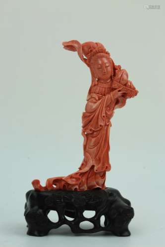 Red roral carving of a Chinese goddess