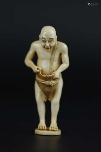 Vintage Netsuke carving of man surprised at his own erection erotic
