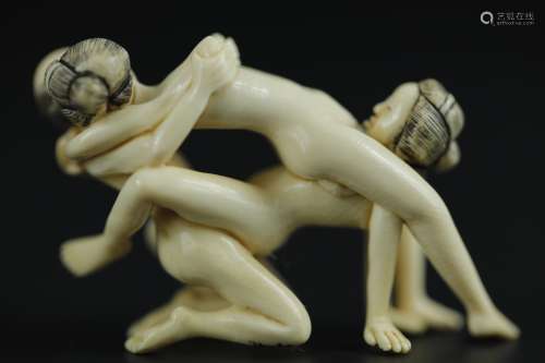 Vintage Netsuke carving of threesome erotic