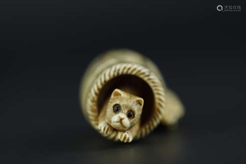 Vintage Netsuke carving of A cat in the barrel eith a rat on top