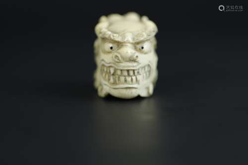 Vintage Netsuke carving of a foo lion's head