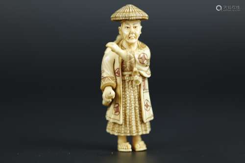 Vintage Netsuke carving of a Samurai traveler