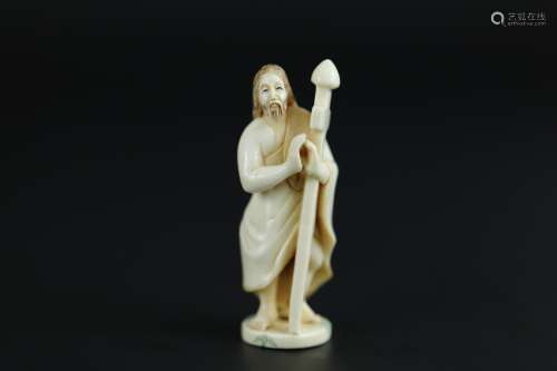 Vintage Netsuke carving of Jesus holding a cross erotic