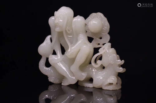 QING DYNASTY HETIAN JADE MONK AND DRAGON FIGURE