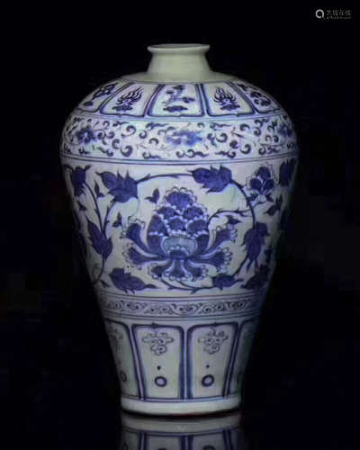 BLUE AND WHITE VASE WITH FLOWER DESIGN