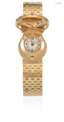 Circa 1930  J. Schulz retailed by Cartier. A lady's 14K gold manual wind bracelet watch with concealed dial