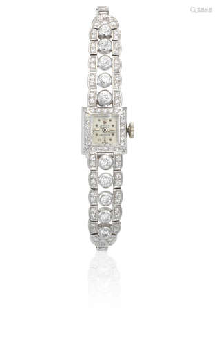 Circa 1940  Rolex. A lady's 18K white gold and diamond set manual wind cocktail bracelet watch