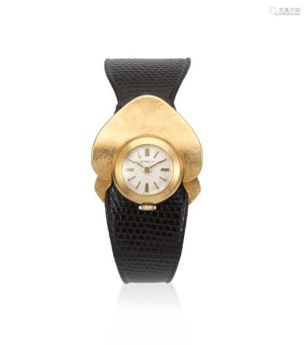 Circa 1950  Gubelin. A lady's 18K gold manual wind unusual form wristwatch