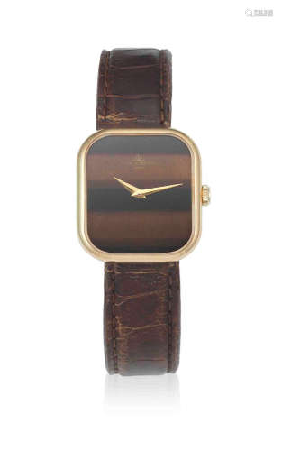 Ref: 38304, Circa 1990  Baume & Mercier. A lady's 18K gold manual wind rectangular wristwatch with tigers eye dial