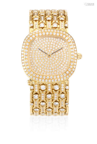 Circa 1980  A custom made heavy 18K gold and diamond set automatic bracelet watch