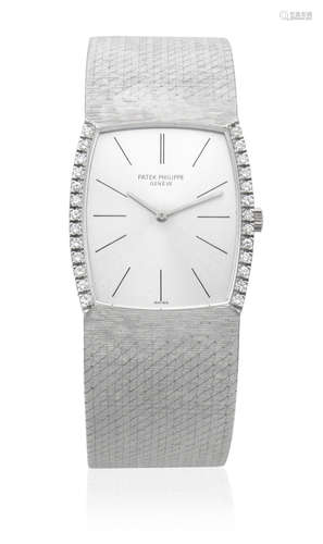 Gondolo, Ref: 3528/4, Circa 1972  Patek Philippe. An 18K white gold and diamond set manual wind tonneau form bracelet watch