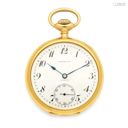 Circa 1915  Patek Philippe Retailed by Tiffany. An 18K gold key wind open face pocket watch