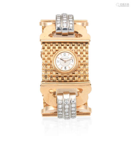 Circa 1970  Jaeger-LeCoultre. A lady's 18K gold and diamond set manual wind cuff bracelet watch
