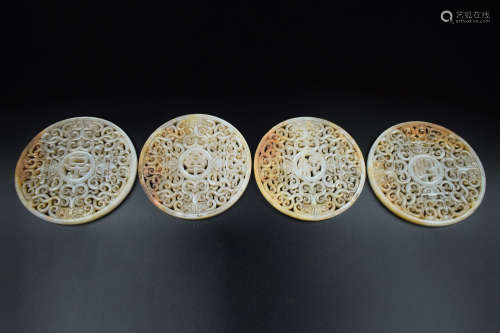 FOUR JADE OPENWORK CARVED 'MYTHICAL BEASTS' DISCS