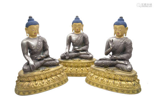 GROUP OF THREE SILVER CAST BODHISATTVA SEATED FIGURES