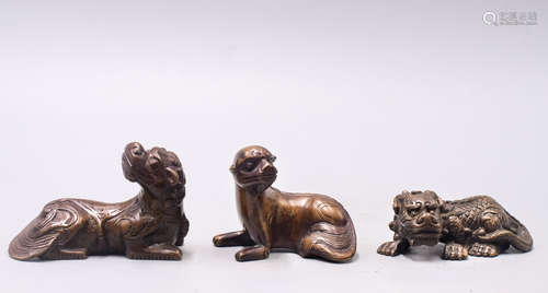 GROUP OF THREE BRONZE CAST MYTHICAL BEASTS