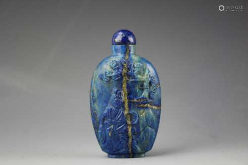Chinese Lapis Lazuli snuff bottle with golden veins. Low relief carved figure of a lady seated beneath the tree of life with matching stopper. 19th century
