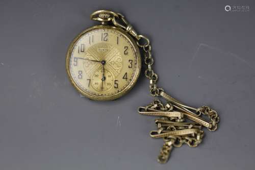 Vintage Elgin gold pocket watch with secondary dial, crystal frame and chain. Accurate movements