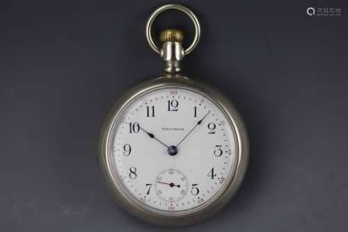 Vintage Waltham silver pocket watch with white dial and  black Arabic numerals. No movements.